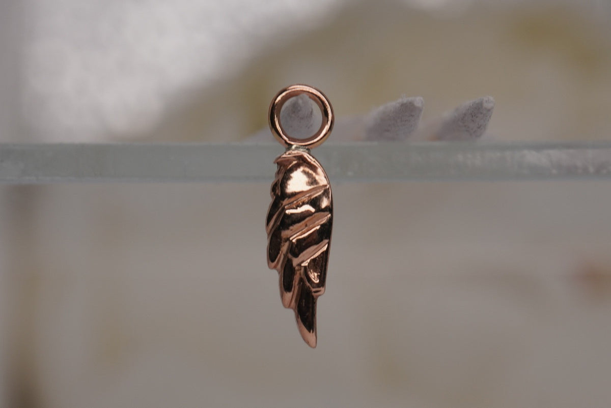 Forward Facing Norvoch 14k Angel Wing Charm in rose gold piercing chain, front view